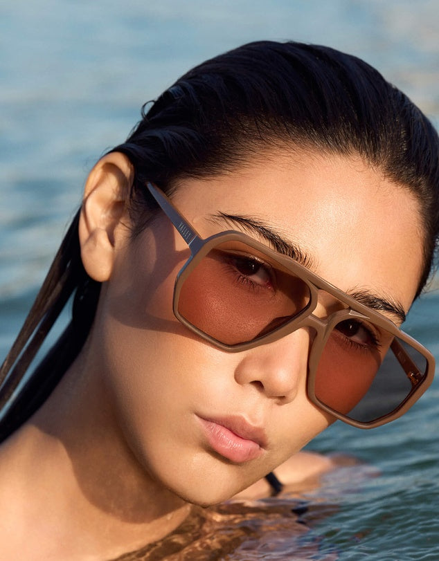 Woman in water modelling Valley Eyewear Sunglasses