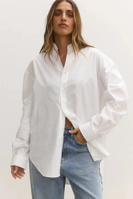 White long sleeve shirt with blue bayse jeans at clothlifestyle boutique 